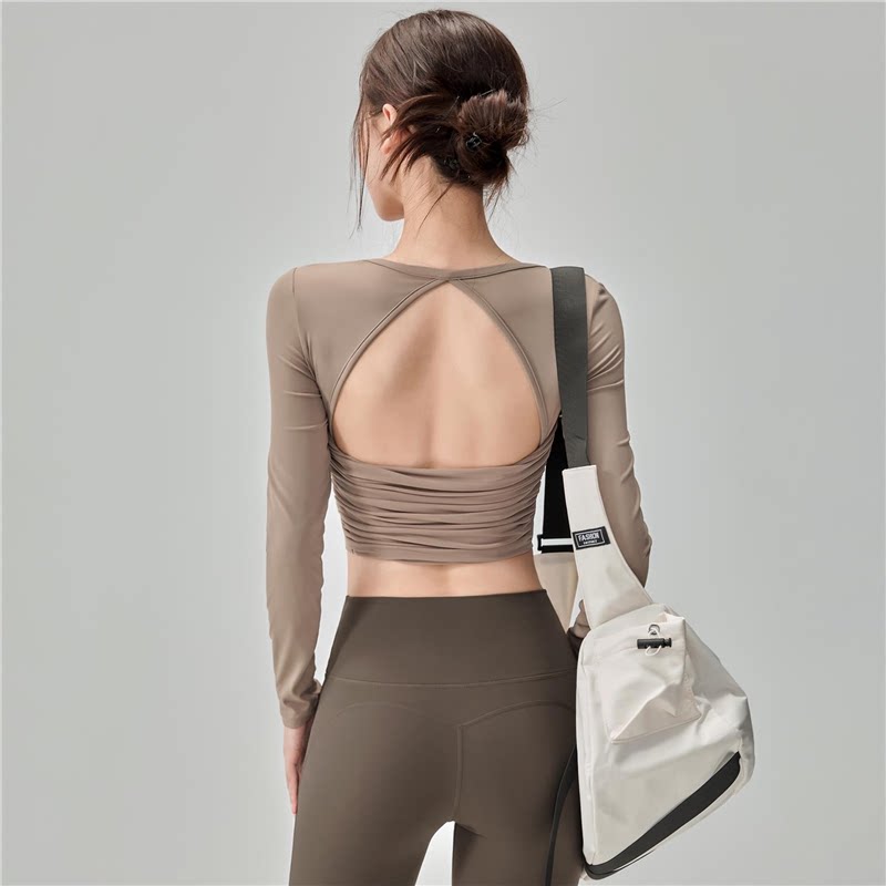 Pilates Yoga One - เสื้อโยคะแขนยาวสำหรับผู้หญิง ดีไซน์สวย โชว์แผ่นหลัง มีฟองน้ำเสริมหน้าอกในตัว ชุดออกกำลังกายสำหรับวิ่ง ฝึกซ้อม